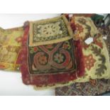 A red leather Saddle Cloth with green suede edging, a fragment of an antique crimson and green