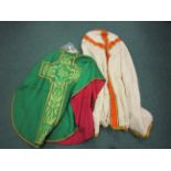 A white silk  brocade Cope with orange satin ophreys, lined in gold. An emerald green Chasuble,