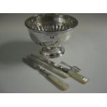 A George V silver small semi-fluted Rose Bowl, Sheffield 1911, maker: Walker & Hall, two silver