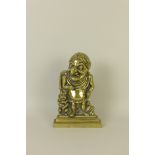 A 19th Century brass Doorstop depicting Mr Punch in Roman costume, 12in H