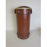 A leather cordite tube converted to an Umbrella Stand with leather handle, 20in H