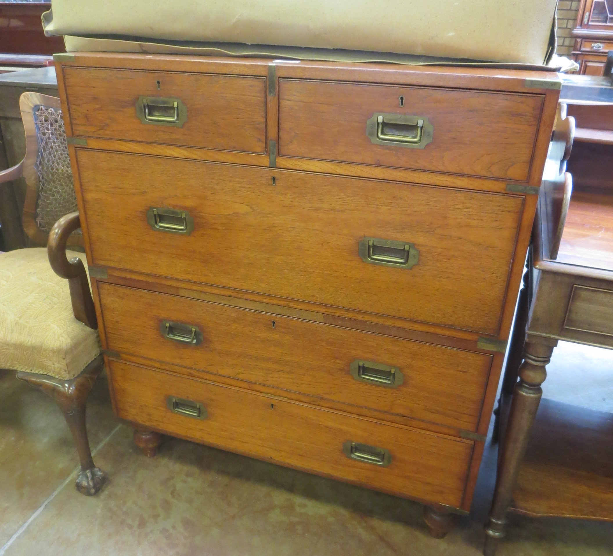 An early 19th Century brass mounted Military Campaign Chest of two short and three long drawers in