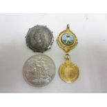 A George V 9ct gold Sporting Medallion, an enamel Football Medal, Victorian Half Crown 1889 and a