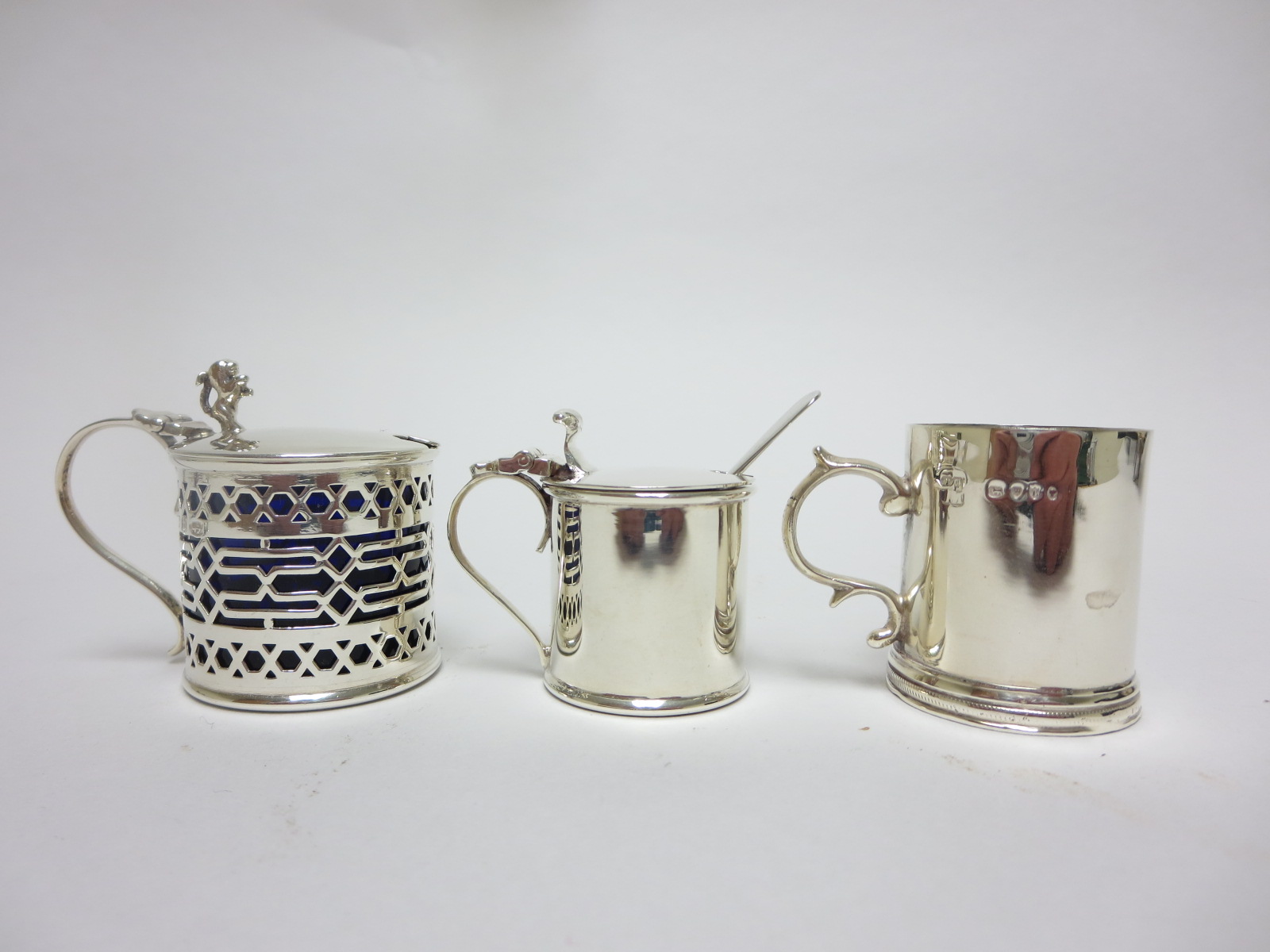 A Victorian silver miniature Mug, London 1886, and two drum Mustard Pots, Birmingham 1896 and