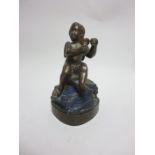 A bronze Figure of Bacchus seated on a lapis rock and shaped square base, 6in