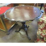 An antique mahogany pie crust Tripod Table on pad feet, 29in D x 27in H