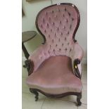 An early Victorian rosewood Lady’s Armchair with button upholstered back, scroll arms and cabriole