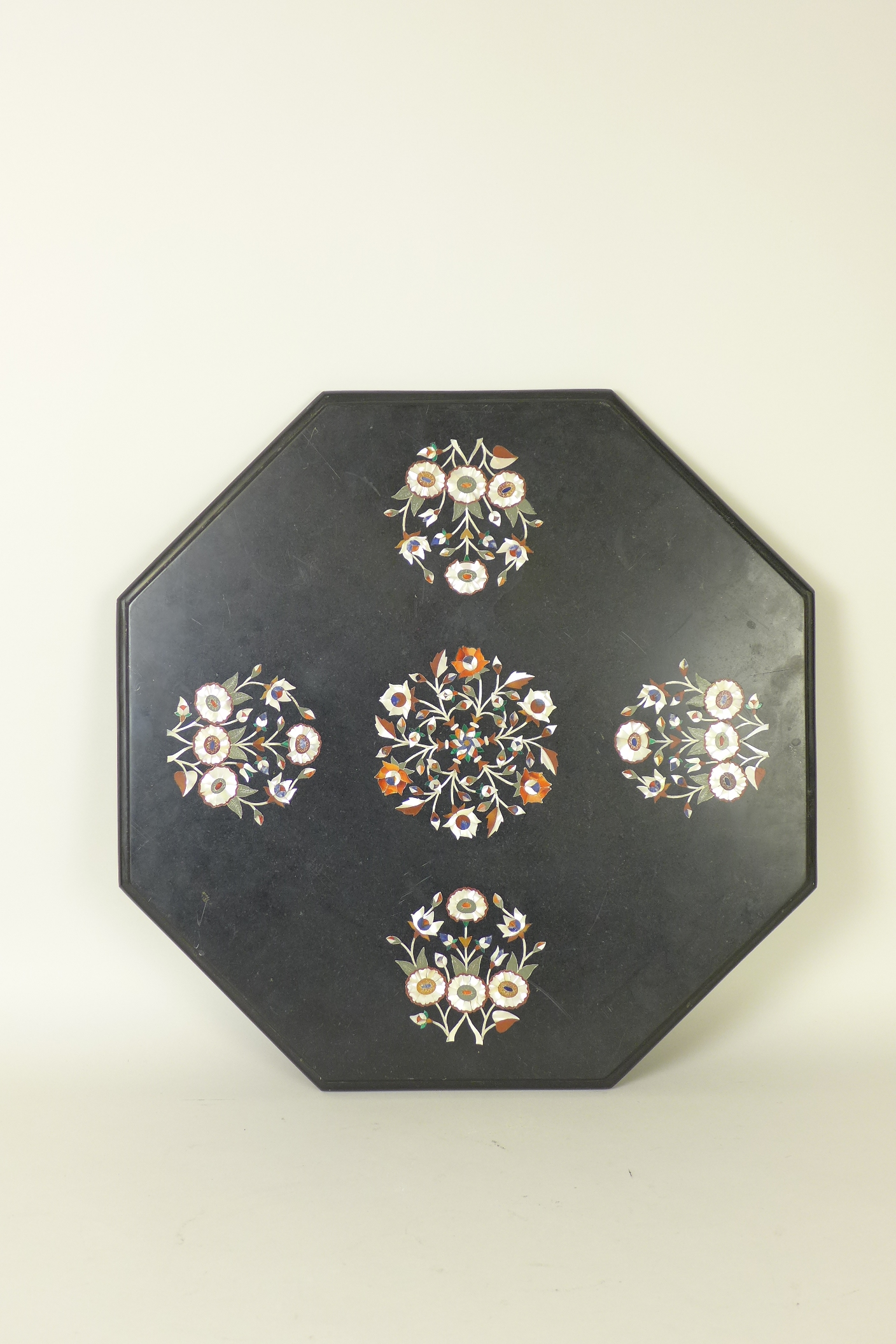 A Pietra Dura marble Top of octagonal form with floral decoration, 22in