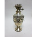 A Victorian silver Oil Lamp with ram’s head masks, swags, leafage frieze, etc, London 1890