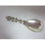 A Scandinavian silver Wedding Spoon with engraved pear shape bowl and eleven spiral rings to the