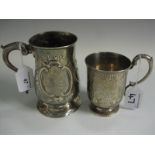 A George III silver Mug with scroll embossing and later inscription, 5in H, London 1783 and a