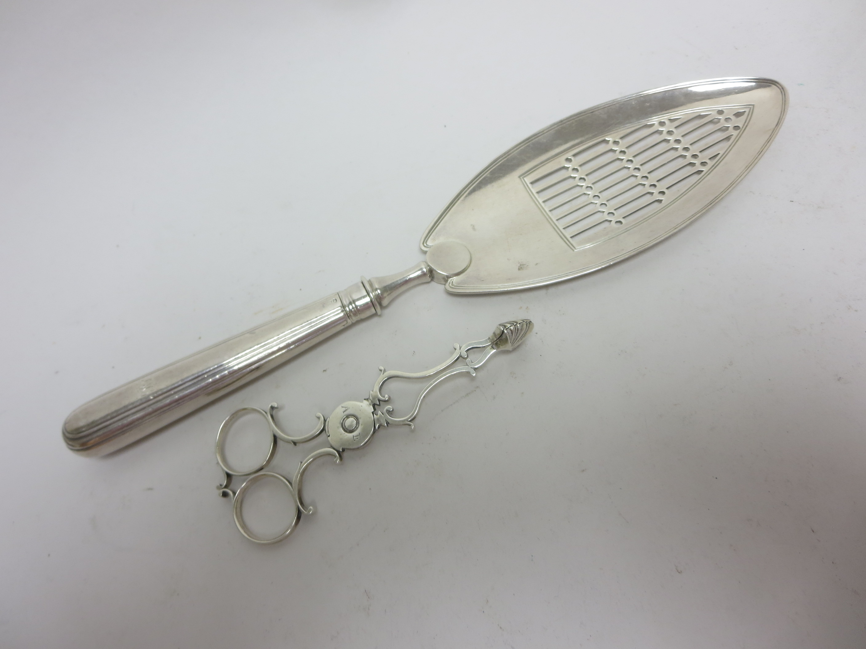 A George III silver Fish Slice with pierced oval blade, London 1794 and a pair of Georgian Irish