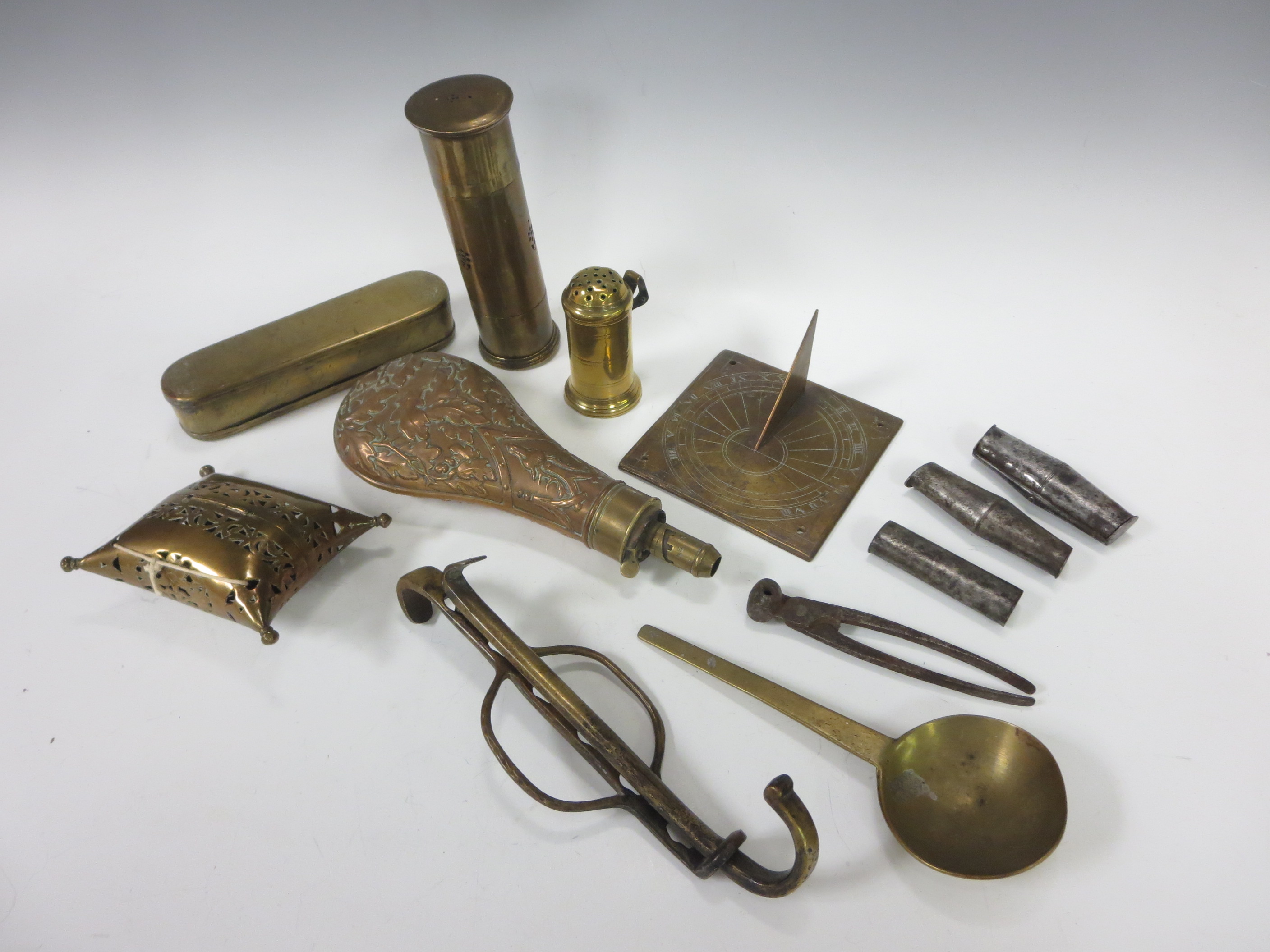 An antique Dutch brass Tobacco Box, a Sundial, embossed Shot Flask, Bullet Mould, steel Bullet