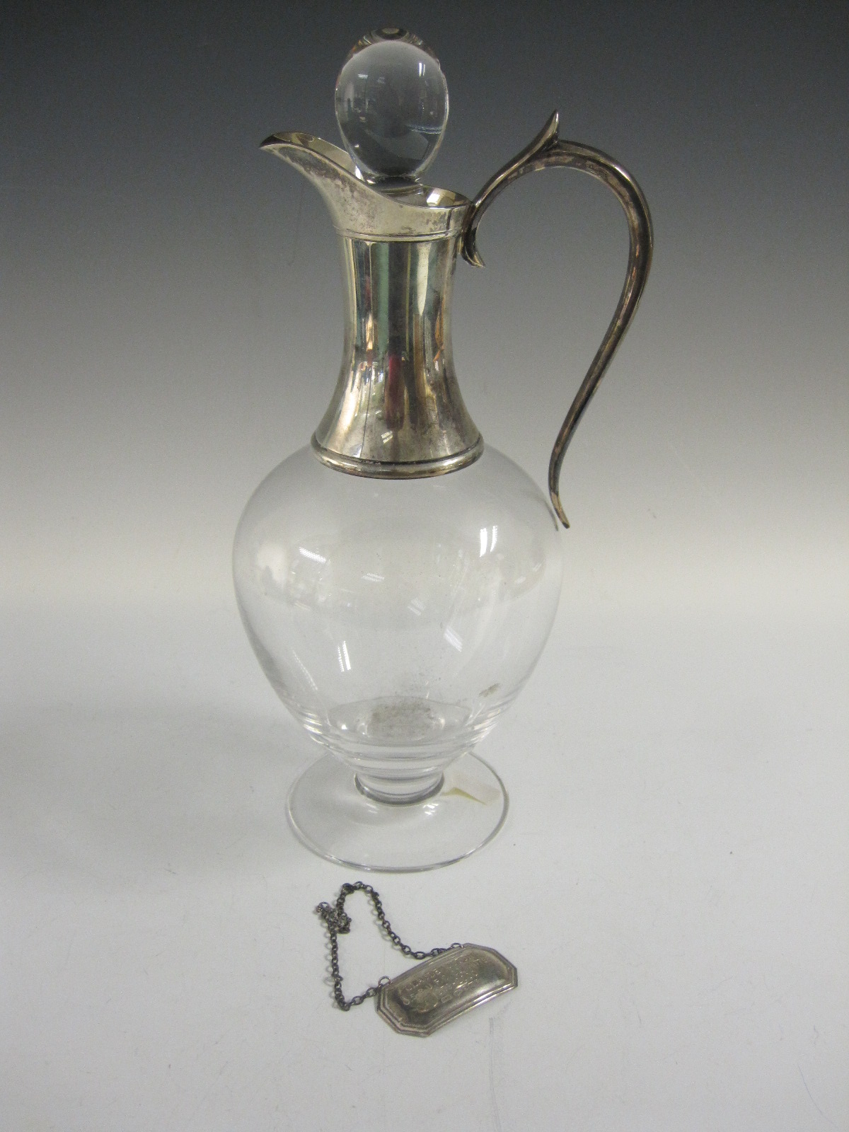 A modern silver mounted glass Claret Jug, London 2000, and a Wine Label