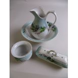 A doll’s turquoise and white flower painted Toilet Set and a toy Dinner Service printed with various