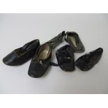 A pair of antique black shoes 5in L, a pair of glacé dolls shoes with pompoms and tie fronts 4 1/4in