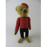 A fine yes/no bellhop Schuco Teddy Bear with boot button eyes, clipped muzzle, tail operated head
