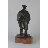 Beszedes, A bronze Statue of a figure wearing a cape on a marble base, 17in H overall