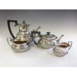 An Edward VII/Victorian silver four piece Tea Service of semi-fluted boat shape, Chester 1898/1901