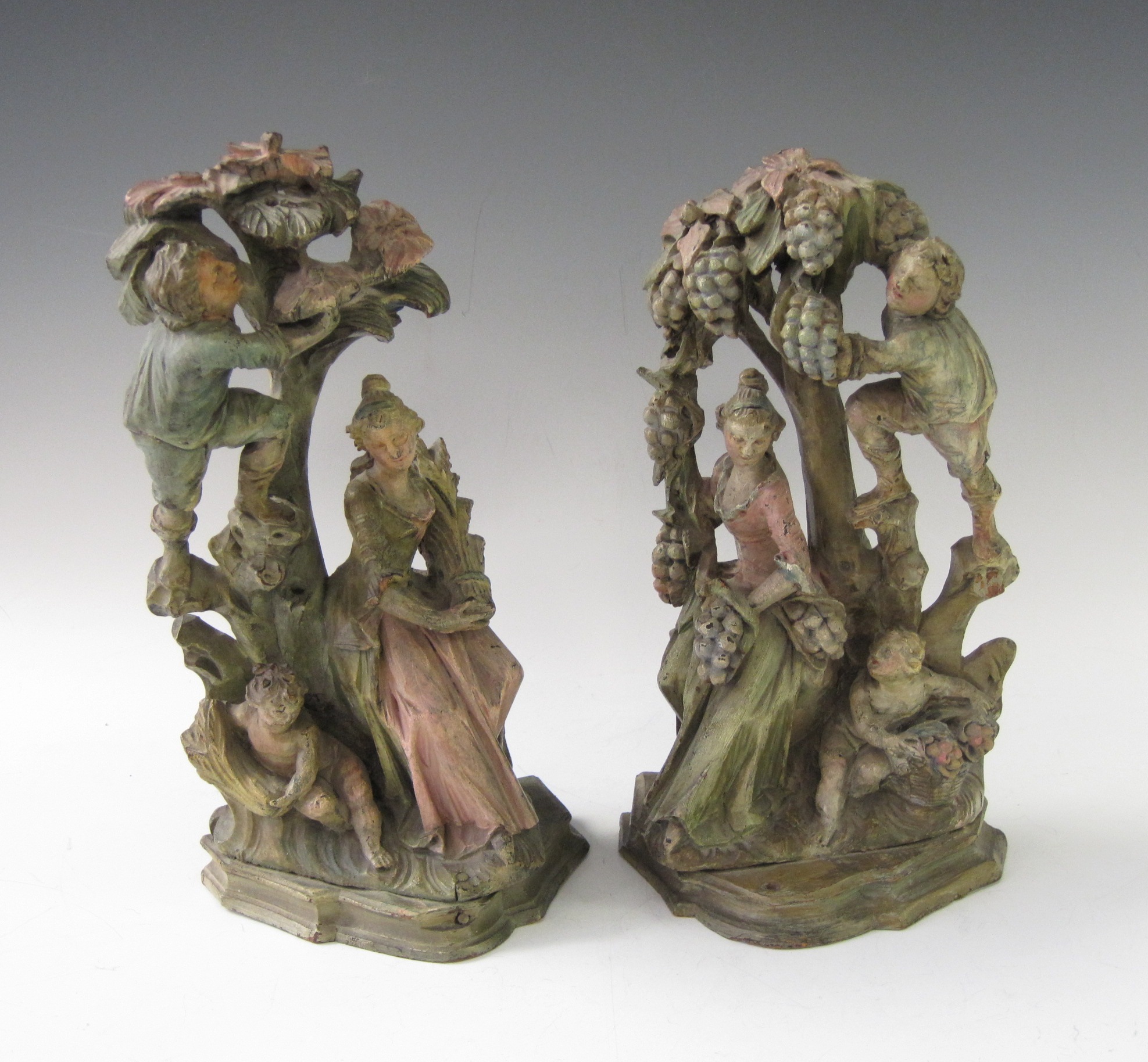 A pair of 18th Century style carved and painted limewood Figures, 11in