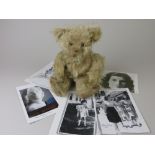 A shaggy pale gold mohair musical Teddy Bear with bellows mechanism. Plays Twinkle Twinkle.