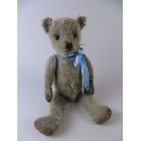 A blue Chiltern fully jointed Teddy Bear with painted back eyes. Original pads. 1930’s. 20in H