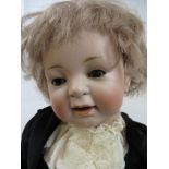 A Kestner bisque headed character Doll with sleeping brown eyes and plaster pate. Five piece