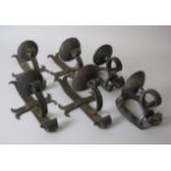 Two pairs wrought iron single branch Wall Sconces/Brackets and a pair of horseshoe Wall Sconces