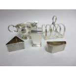 A George V silver Toastrack, Sheffield 1934, a Milk Jug, Birmingham 1930, a Pepperette, six Coffee