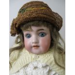 A bisque headed Simon & Halbig girl Doll with blue sleeping eyes, fully jointed body and original