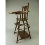 A doll’s folding High Chair converting to a push along, labelled Pearson & Pearson, 12 Angel Row,