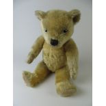 A golden Chiltern Hug Me Bear with painted back eyes and original pads. Fully jointed. 1930’s.