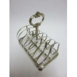 A Victorian silver seven bar Toastrack with central handle on scroll feet, Sheffield 1838, maker: