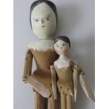 A St Ulrich turned and carved jointed wooden Doll with shaped feet, 19th Century and a smaller
