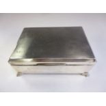 A George VI large silver Cigarette Box with engine turning on bracket feet, Birmingham 1939