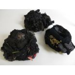 A small black straw Bonnet trimmed with chiffon, a black velvet bonnet trimmed with artificial