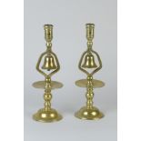 A pair of Victorian brass Tavern Sticks mounted with bells with broad drip pans and circular