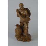 A carved wooden Figure of a Japanese Fisherman, 10 1/2in