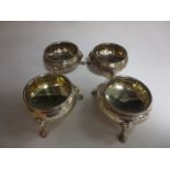 A pair of Victorian silver Cauldron Salts, floral engraved on hoof feet, London 1848 and another