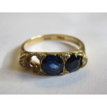 A Sapphire three stone Ring pavé-set cushion-cut stones, one stone deficient, in 18ct gold, ring