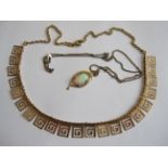 An Opal Pendant claw-set oval cabochon, stamped 585, on fine gilt-metal chain, and a Greek key