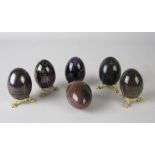 A Collection of six egg shaped polished mineral Ornaments including, Agate, Serpentine, Iolite,