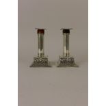A pair of Victorian silver Candlesticks with cylindrical columns mounted with tortoiseshell, and