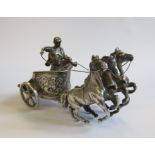 A Continental silver Chariot with three horses and figures, import mark Chester, 1911 maker BML