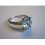 An Aquamarine and Diamond Ring claw-set oval-cut aquamarine, 1.88cts, with brilliant-cut diamonds