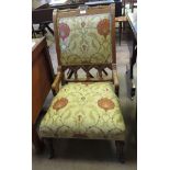 A Victorian upholstered Bedroom Chair in the gothic style on turned front supports