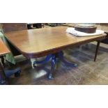 A late Regency mahogany Breakfast Table having rectangular top on turned column with quadruple