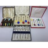 Three sets of silver and enamel Coffee Spoons and six plated apostle handled Coffee Spoons, all