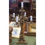 A 19th Century gilt metal four branch Candelabra with central sconce and scrolled triangular base,