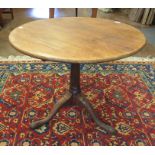 A Georgian mahogany Pillar Table with circular top on gun barrel turned column and plain tripod